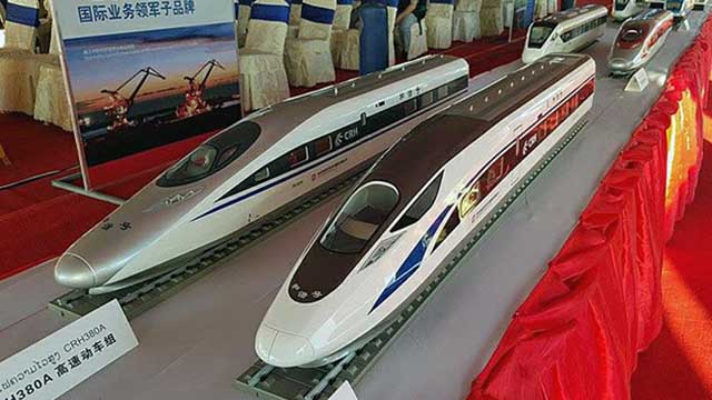 Models of high-speed trains that will operate on the Laos-China railway are displayed during the project's groundbreaking ceremony in Vientiane, Dec. 2, 2015. 